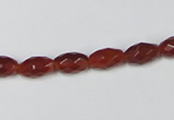 CAA124 15.5 inches 6*10mm faceted rice red agate gemstone beads