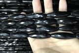 CAA2508 15.5 inches 12*50mm faceted rice black agate beads wholesale