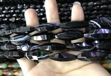 CAA2656 15.5 inches 10*30mm faceted rice banded black agate beads