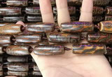 CAA2697 15.5 inches 14*38mm - 16*43mm rice tibetan agate dzi beads