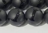 CAA3657 15.5 inches 10mm round matte & carved black agate beads