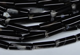 CAG2974 15.5 inches 4*14mm tube black line agate beads