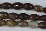 CAG3129 15.5 inches 10*14mm faceted rice brown line agate beads