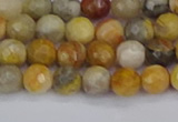 CAG9868 15.5 inches 4mm faceted round yellow crazy lace agate beads