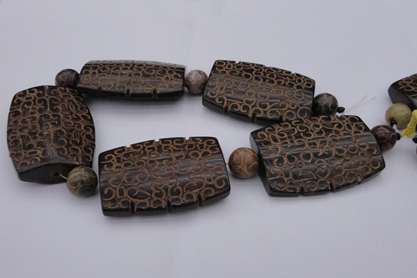 CAL20 14.5 inches 42*59mm carved flat drum agalmatolite beads