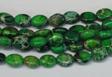 CDE178 15.5 inches 6*8mm oval dyed sea sediment jasper beads