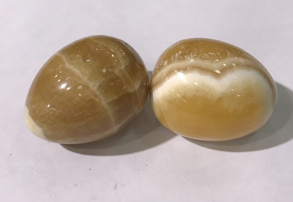 CDN1380 35*45mm egg-shaped yellow calcite decorations wholesale