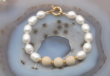 CFB946 Hand-knotted 9mm - 10mm rice white freshwater pearl & white fossil jasper bracelet