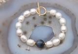 CFB979 Hand-knotted 9mm - 10mm rice white freshwater pearl & blue tiger eye bracelet