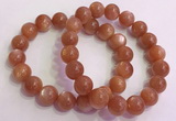 CGB4541 7.5 inches 12mm - 13mm round golden sunstone beaded bracelets