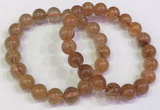 CGB4614 10mm - 11mm round golden rutilated quartz beaded bracelets