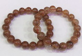 CGB4621 10mm - 11mm round golden rutilated quartz beaded bracelets