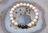 CGB6490 8mm round matte white fossil jasper & black lava beaded bracelets