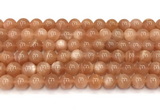 CMS2253 15 inches 10mm round orange moonstone beads wholesale