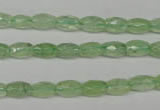 CRU165 15.5 inches 5*8mm faceted rice green rutilated quartz beads