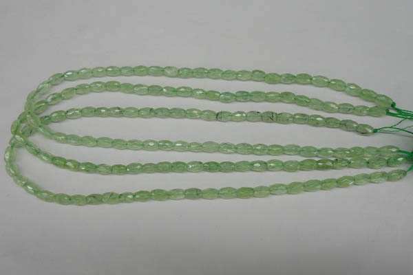 CRU165 15.5 inches 5*8mm faceted rice green rutilated quartz beads