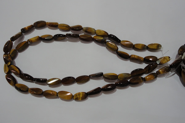 CTE1097 15.5 inches 8*15mm twisted & faceted oval yellow tiger eye beads