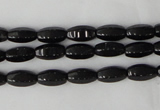 CTO116 15.5 inches 5*10mm faceted rice black tourmaline beads