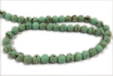 TURQ26 15 inches 4mm round synthetic turquoise with shelled beads